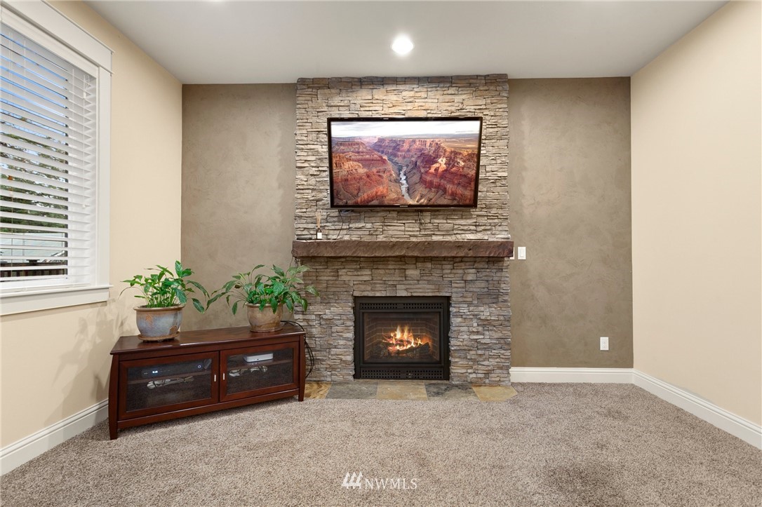 32233 Military Road South Federal Way, WA 98001 - Photo 14 of 28 a living room with furniture and a fireplace