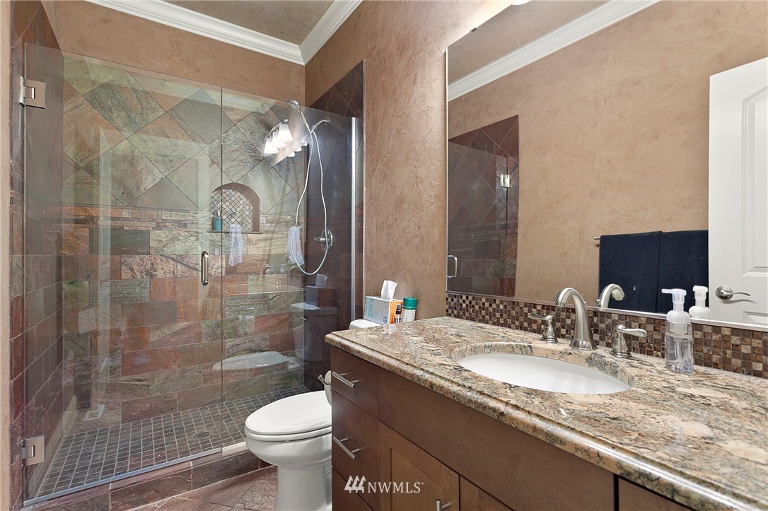 32233 Military Road South Federal Way, WA 98001 - Photo 16 of 28 a bathroom with a granite countertop sink a toilet and shower