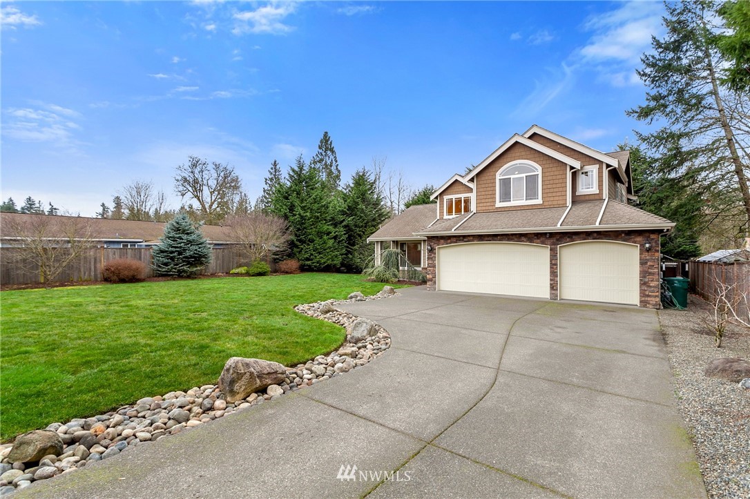 32233 Military Road South Federal Way, WA 98001 - Photo 2 of 28 a front view of a house with garden