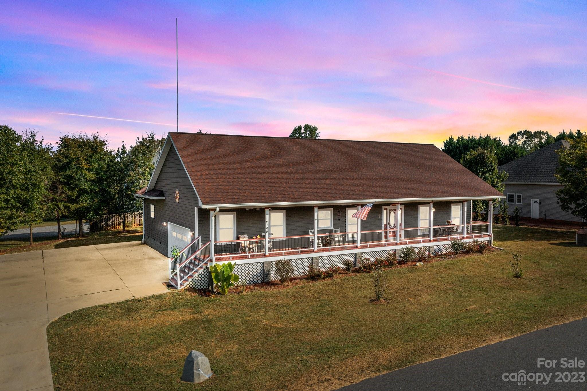 105 Vista Drive Davidson, NC 28036 - Photo 1 of 29 a front view of a house with yard and trees in the background