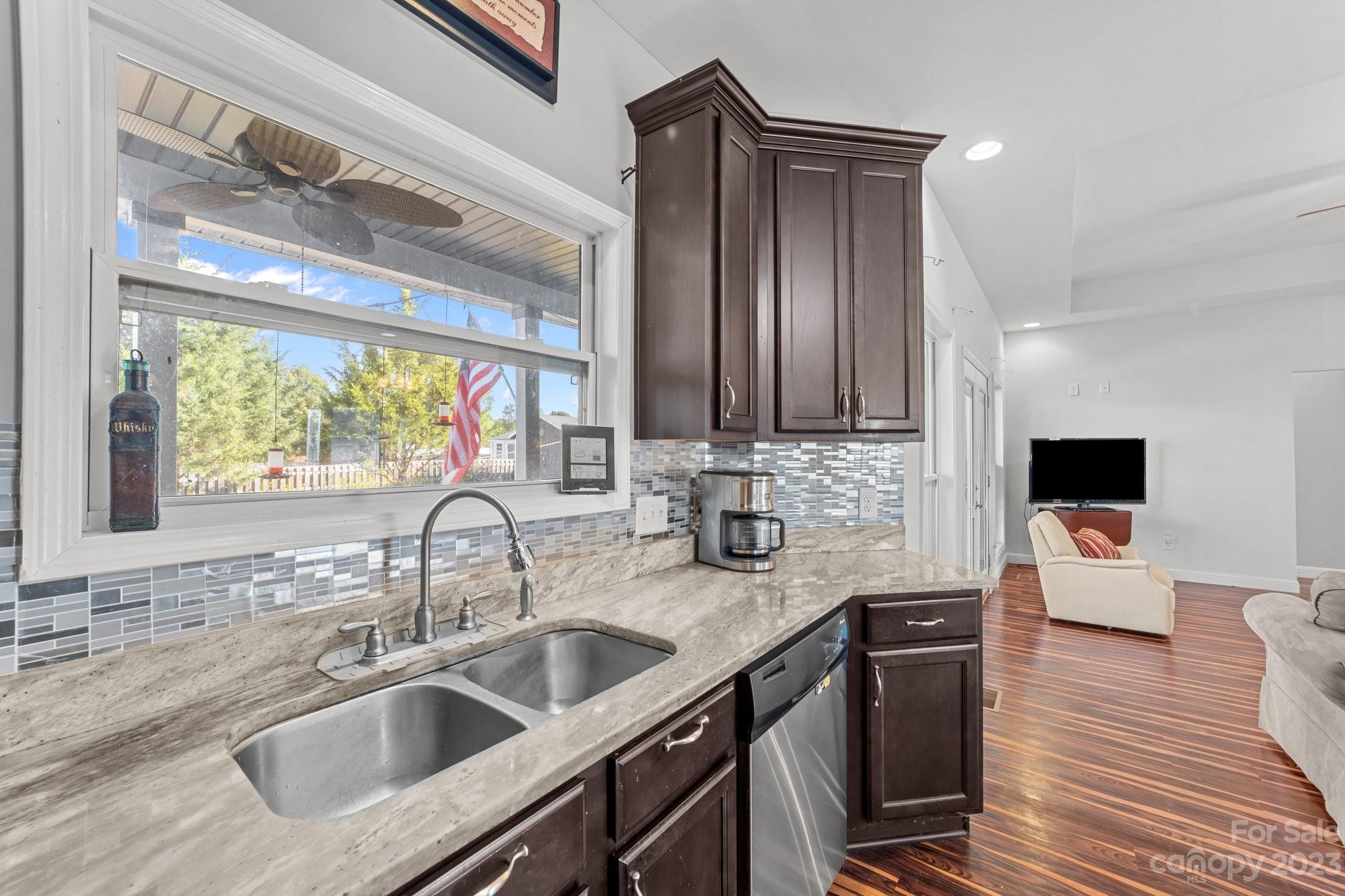 105 Vista Drive Davidson, NC 28036 - Photo 14 of 29 a kitchen with a sink cabinets and a wooden floor
