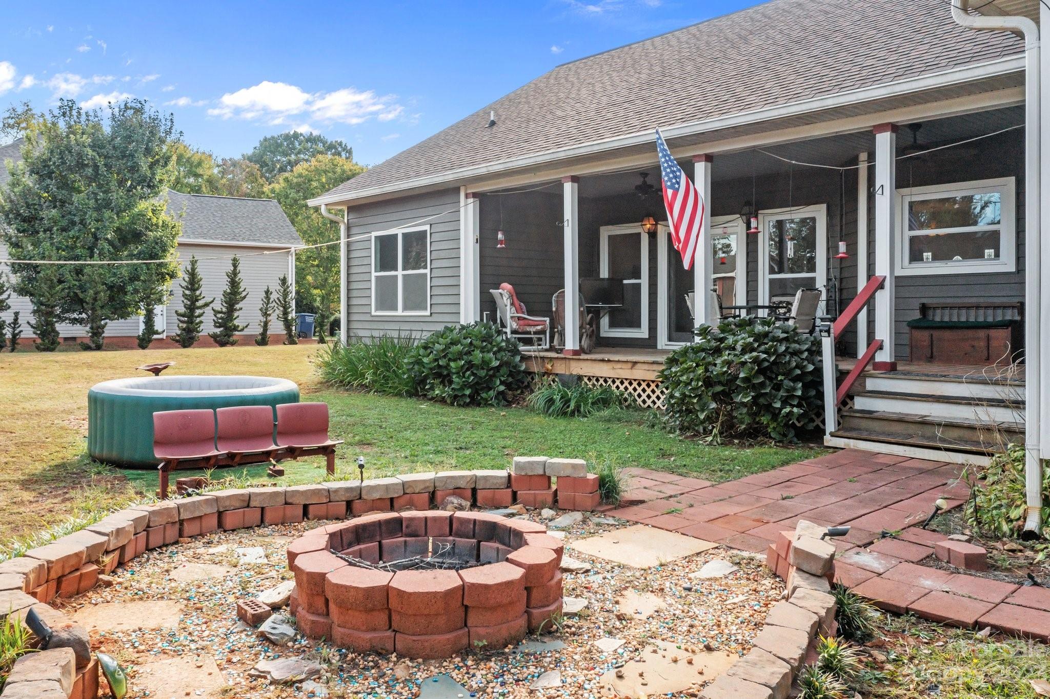 105 Vista Drive Davidson, NC 28036 - Photo 5 of 29 a front view of a house with a garden and plants