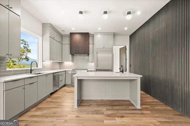 a view of a balcony with an outdoor seating