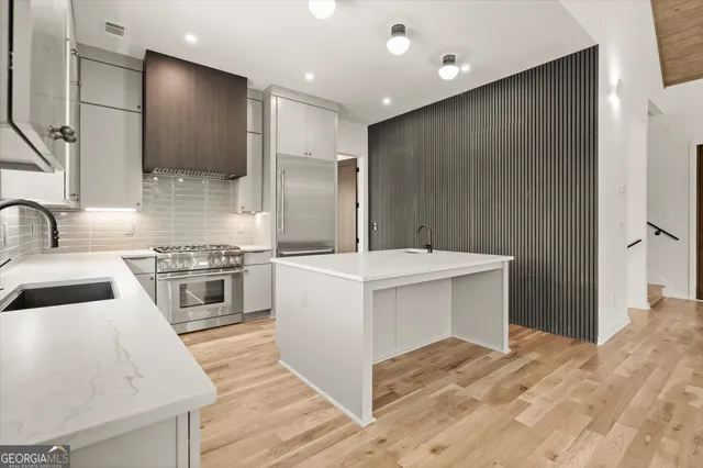 a view of a room with a flat screen tv and outdoor view