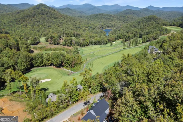 a view of backyard with outdoor seating and stairs