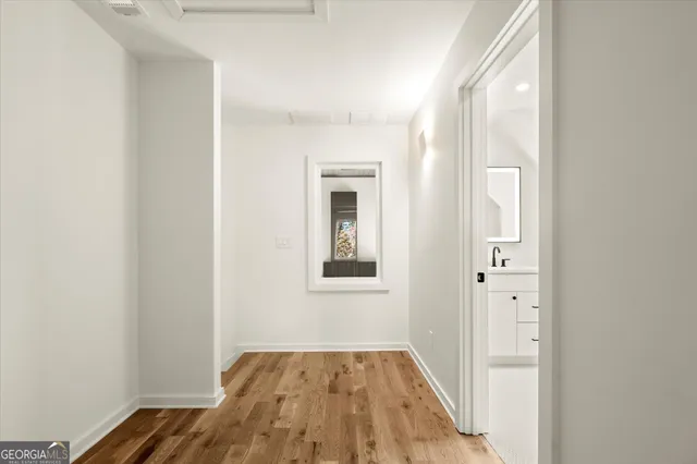 a kitchen with sink a refrigerator and cabinets