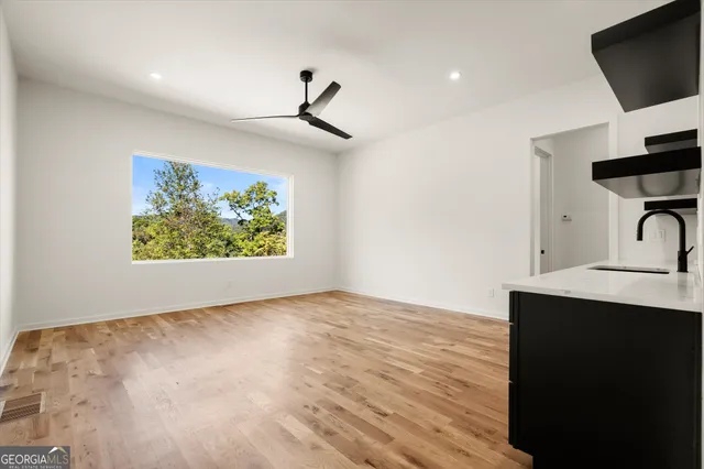 an aerial view of a house with a yard