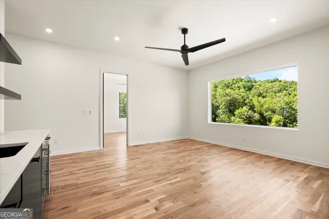 a view of a lush green hillside and houses