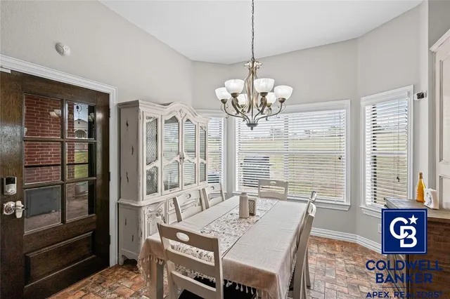a view of a dining room with furniture window and outside view