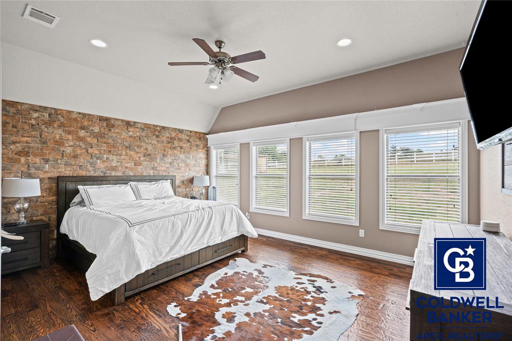 1316 Prairie Point Rhome, TX 76078 - Photo 12 of 30 a bedroom with a large bed and a window