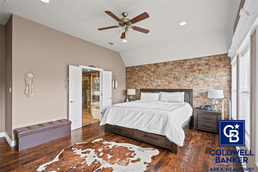 1316 Prairie Point Rhome, TX 76078 - Photo 13 of 30 a bedroom with a bed and a table with closet