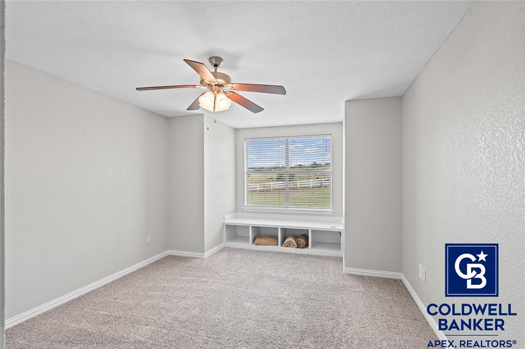 1316 Prairie Point Rhome, TX 76078 - Photo 21 of 30 a view of a room with a ceiling fan and window