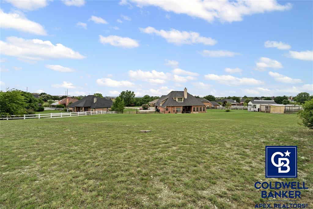 1316 Prairie Point Rhome, TX 76078 - Photo 29 of 30 a view of a lake with houses in the back