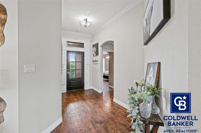 a view of an entryway with wooden floor