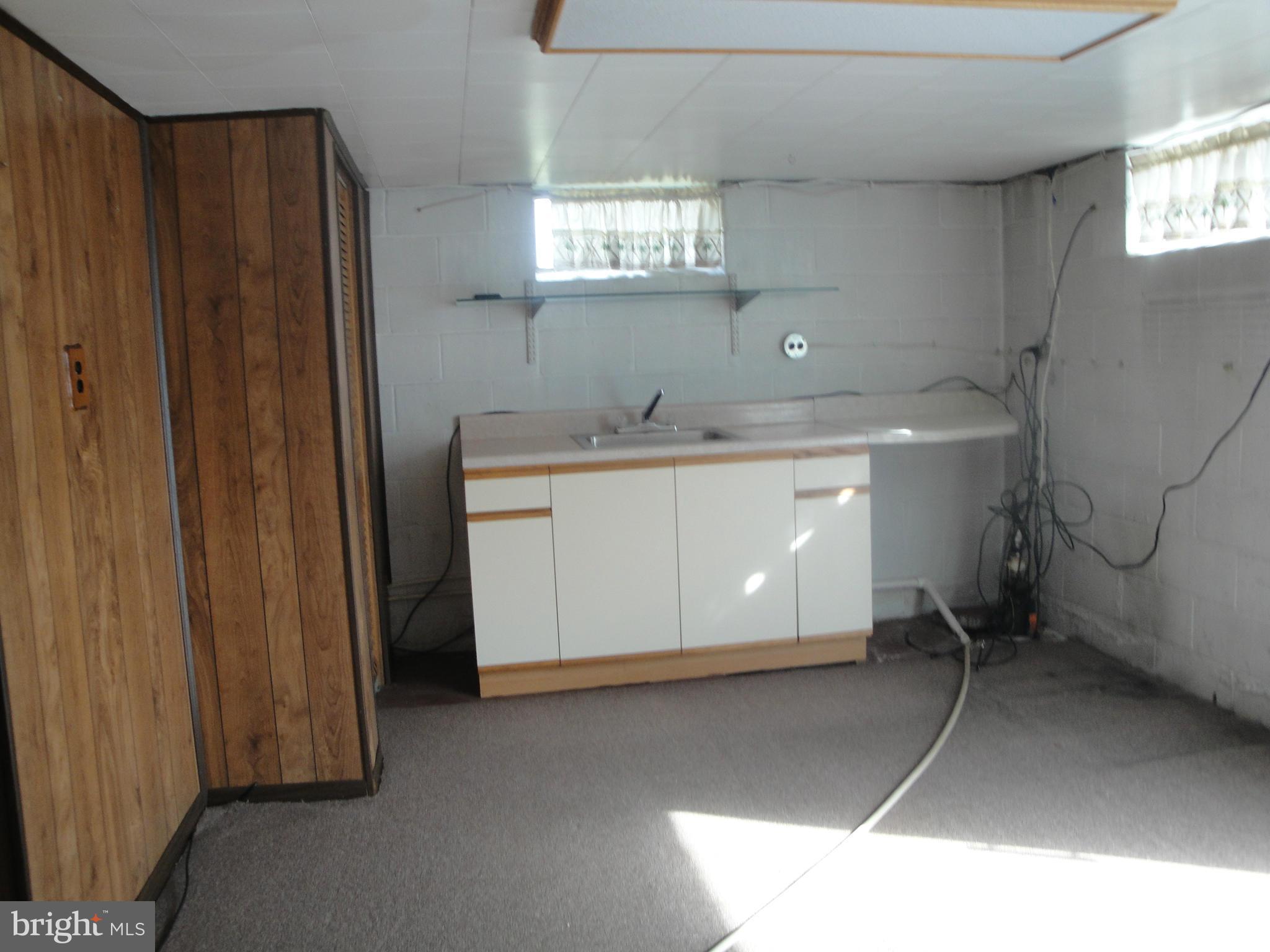 903 Bengies Road Baltimore, MD 21220 - Photo 17 of 18 a room with a sink and cabinets