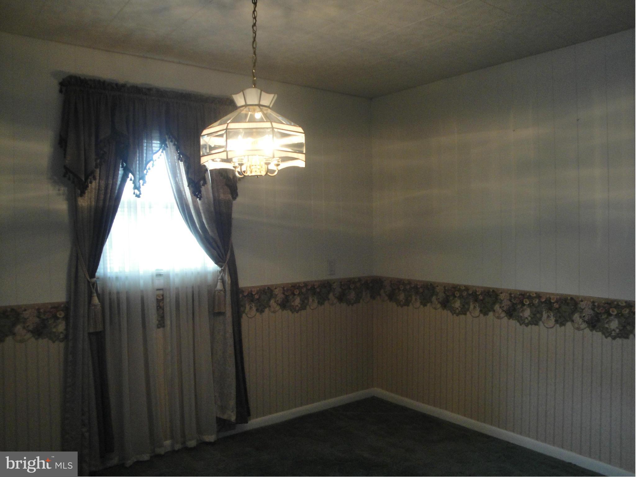 903 Bengies Road Baltimore, MD 21220 - Photo 6 of 18 a view of a decorative light in a hallway