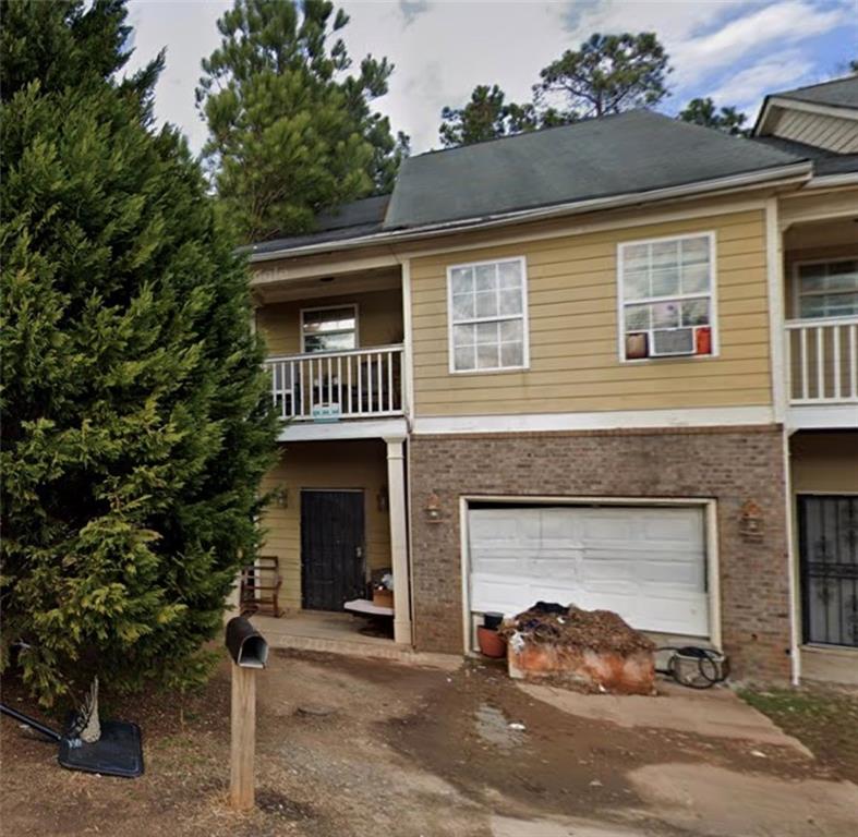 2996 Jonesboro Road Southeast, Unit A Atlanta, GA 30354 - Photo 1 of 1 a front view of a house with yard