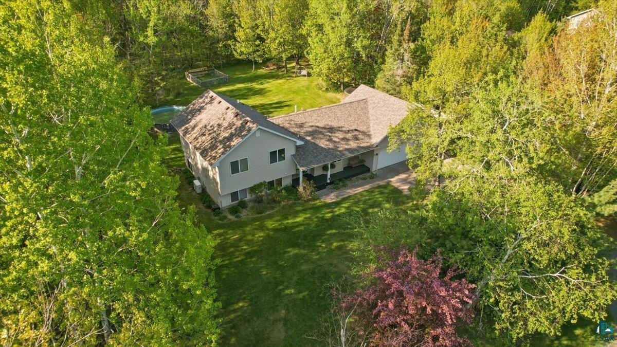 47 Amy Lane Esko, MN 55733 - Photo 30 of 33 Expansive property featuring a two-story residence with a multi-gabled roofline, attached garage, and a covered front porch