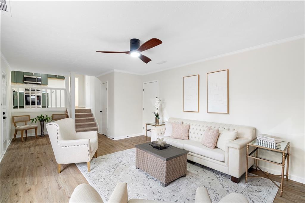 3905 Hunters Chase Southwest Conyers, GA 30094 - Photo 14 of 29 a living room with furniture and a wooden floor