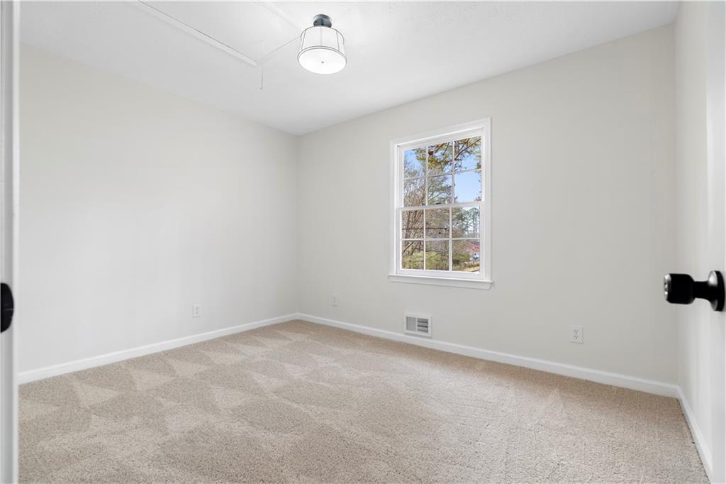 3905 Hunters Chase Southwest Conyers, GA 30094 - Photo 21 of 29 an empty room with a window
