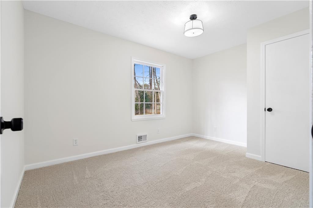 3905 Hunters Chase Southwest Conyers, GA 30094 - Photo 22 of 29 an empty room with windows