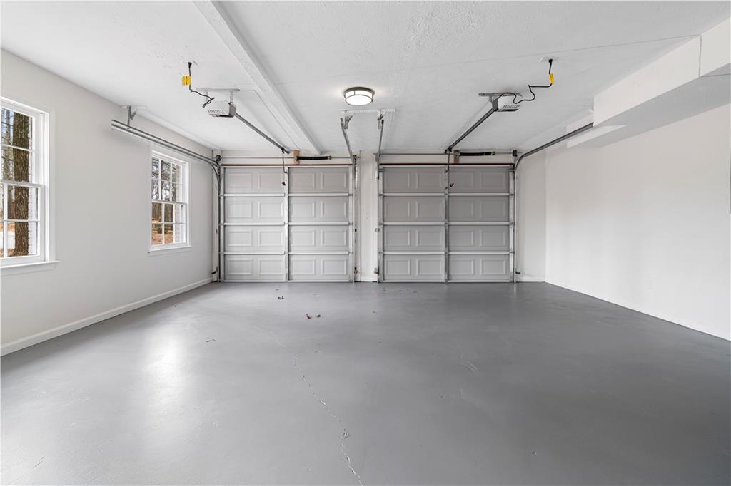 3905 Hunters Chase Southwest Conyers, GA 30094 - Photo 24 of 29 a view of a room with staircase and windows