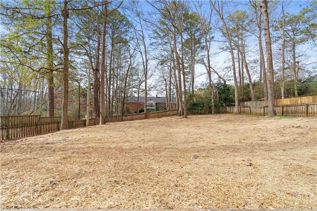 3905 Hunters Chase Southwest Conyers, GA 30094 - Photo 26 of 29 a backyard of a house with lots of green space