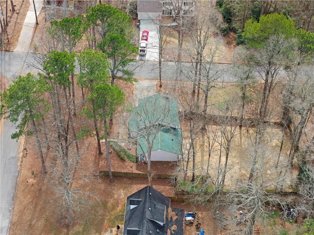 3905 Hunters Chase Southwest Conyers, GA 30094 - Photo 27 of 29 a backyard of a house with lots of green space