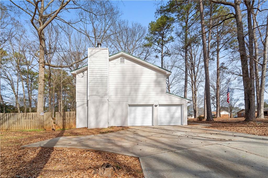 3905 Hunters Chase Southwest Conyers, GA 30094 - Photo 3 of 29 a view of a house with snow on the road