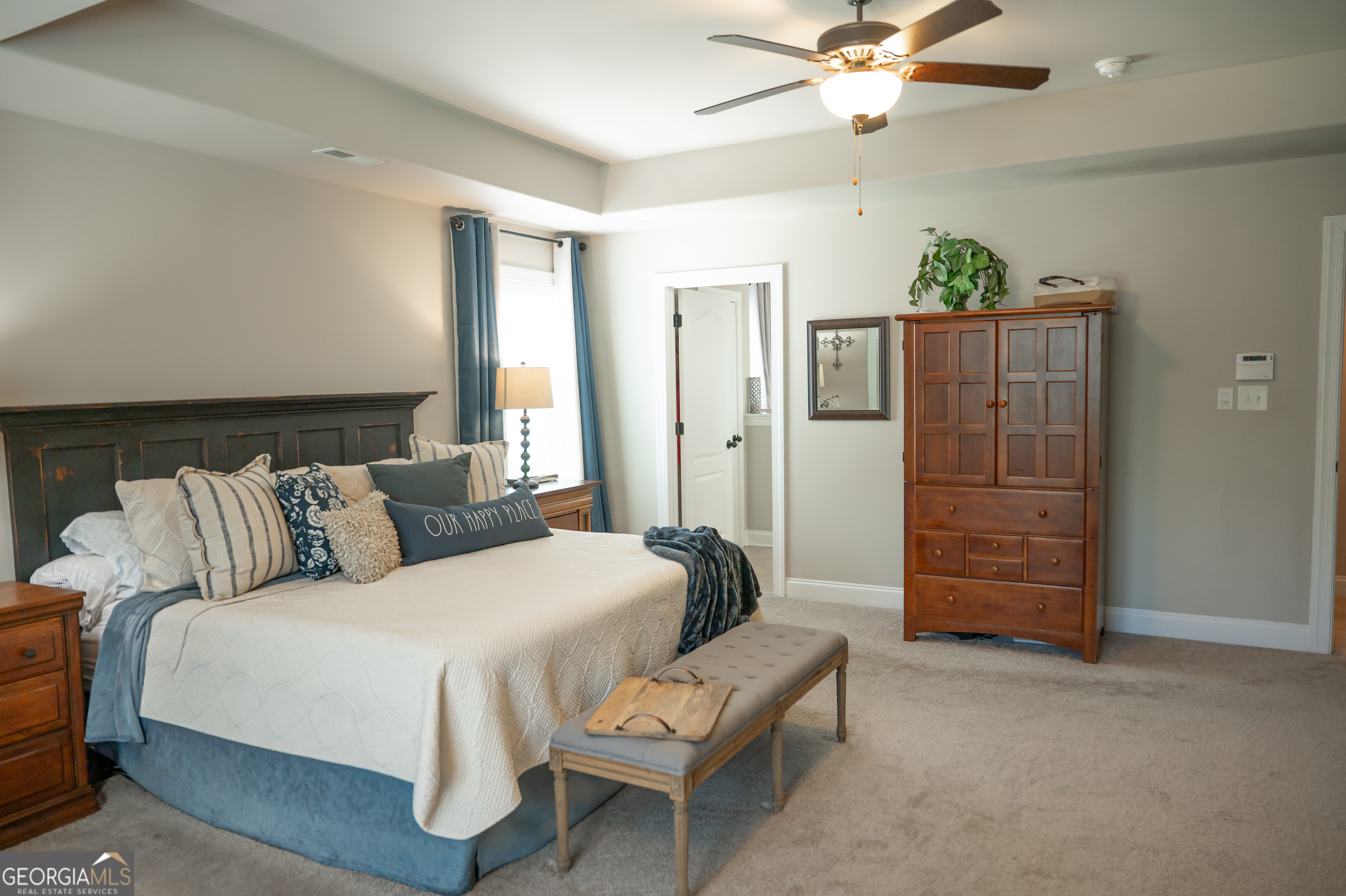 415 EAS Way Fayetteville, GA 30215 - Photo 31 of 70 a bedroom with a bed and wooden floor