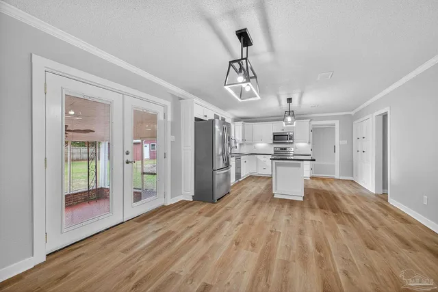 a view of kitchen with wooden floor