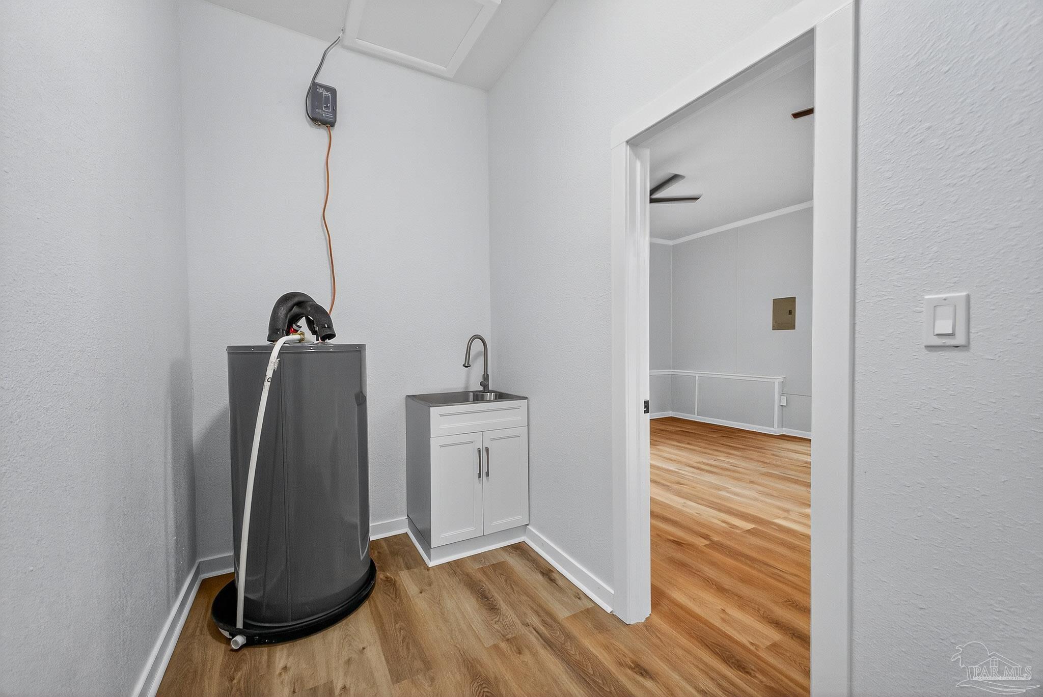 4673 Van Horn Road Milton, FL 32583 - Photo 23 of 48 a view of walk in closet with clothes and shoes