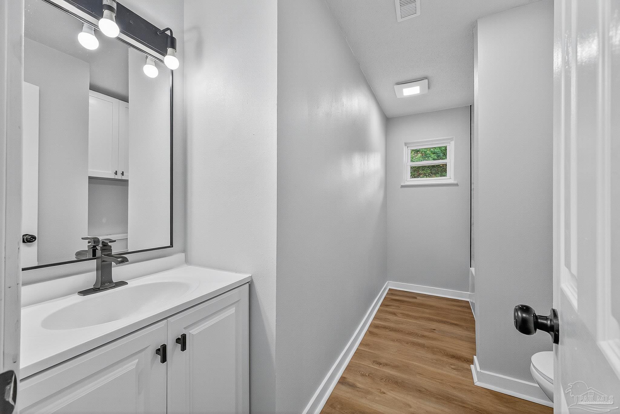 4673 Van Horn Road Milton, FL 32583 - Photo 29 of 48 a bathroom with a sink and a mirror