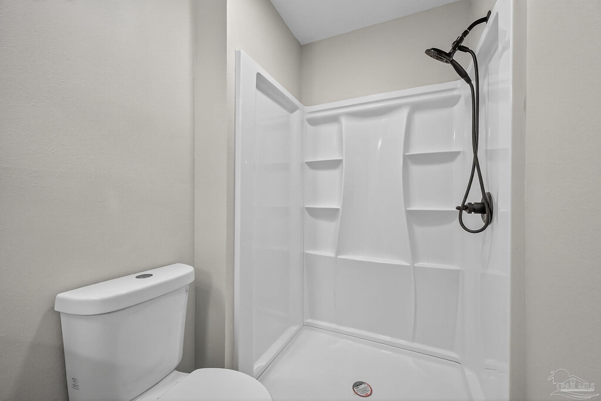 4673 Van Horn Road Milton, FL 32583 - Photo 40 of 48 a bathroom with a shower and toilet