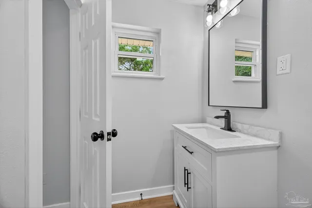 a bathroom with a sink and a mirror