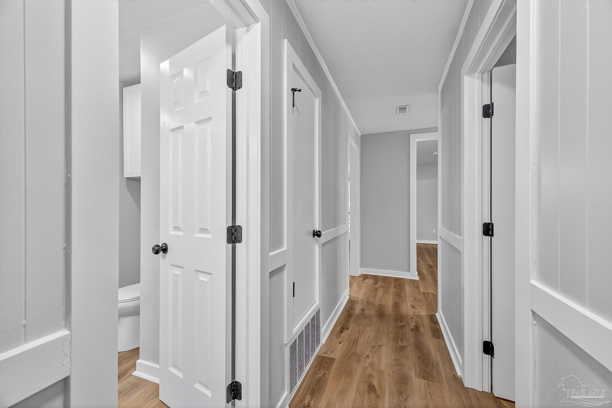 4673 Van Horn Road Milton, FL 32583 - Photo 42 of 48 a view of a hallway with a wooden door