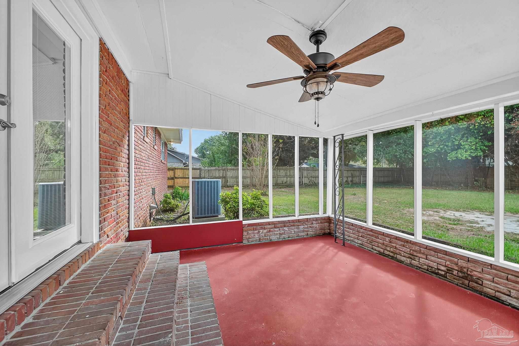 4673 Van Horn Road Milton, FL 32583 - Photo 43 of 48 a view of a livingroom with a ceiling fan and a large window