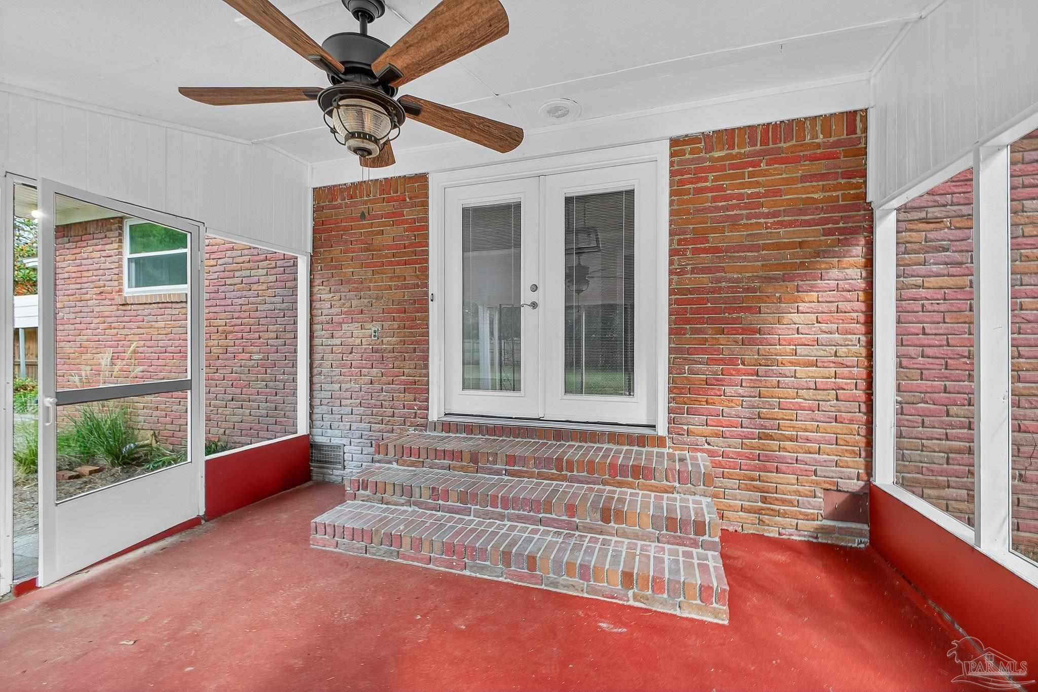 4673 Van Horn Road Milton, FL 32583 - Photo 44 of 48 a view of an empty room with a window and a ceiling fan