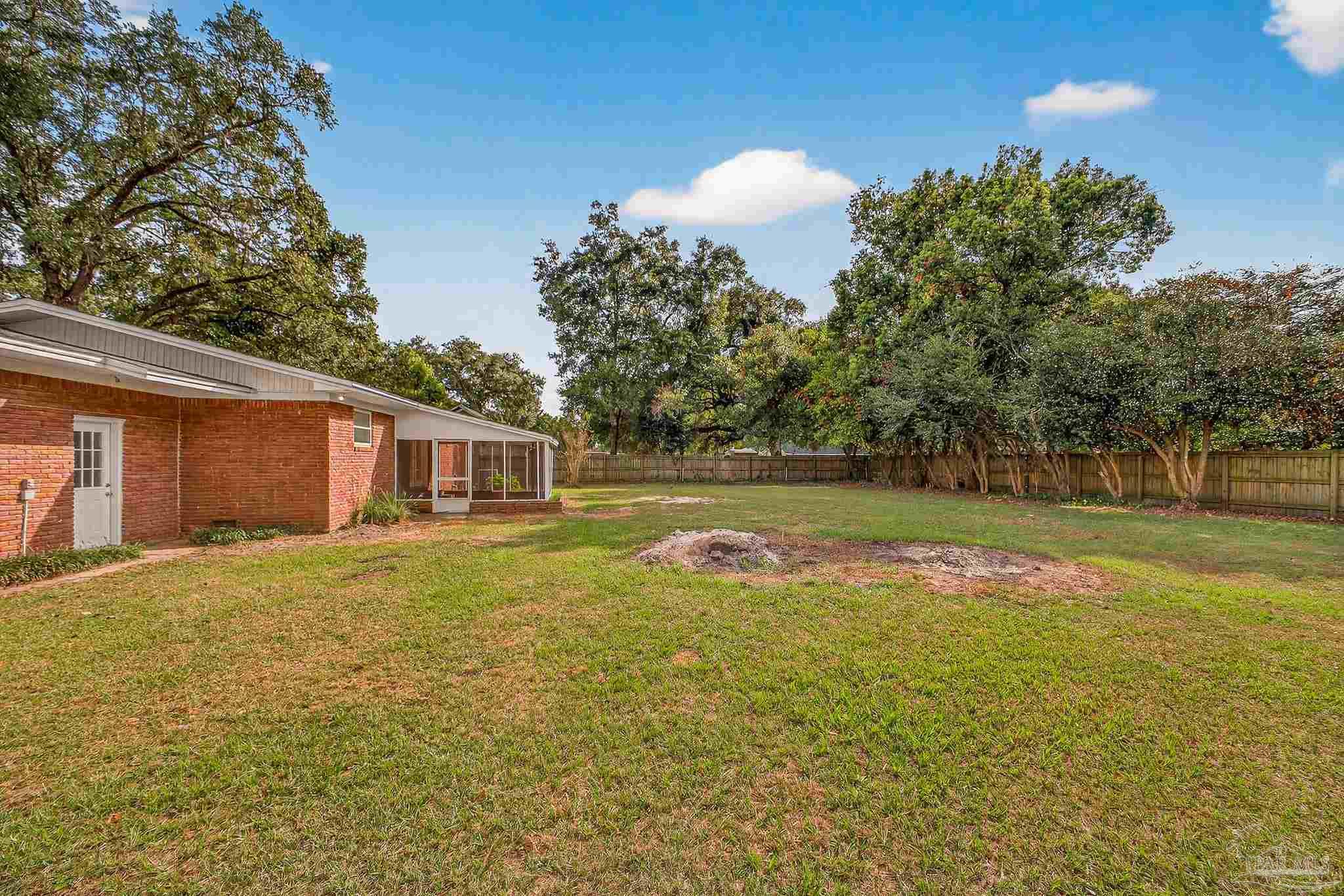 4673 Van Horn Road Milton, FL 32583 - Photo 46 of 48 a view of a house with a yard