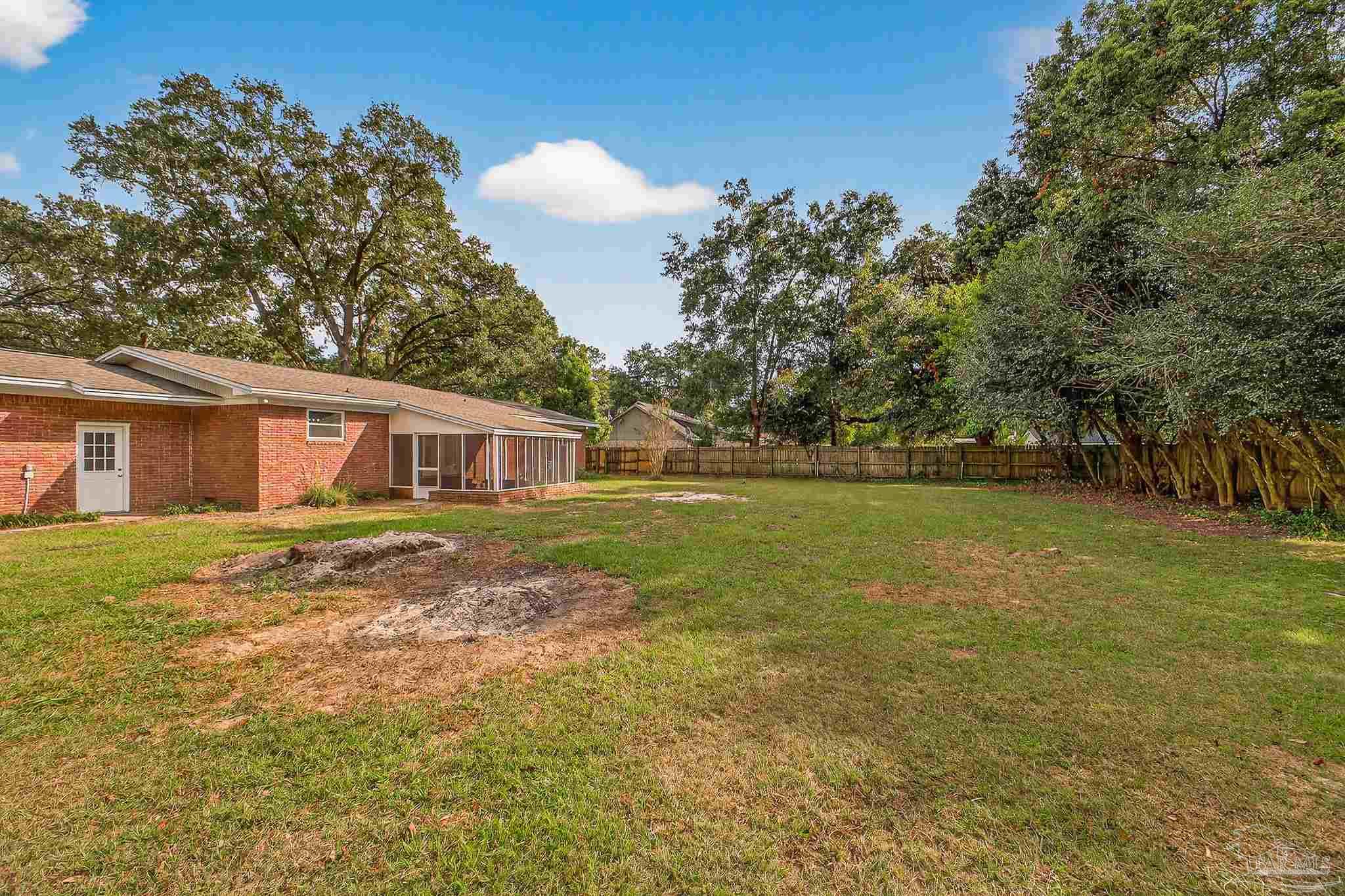 4673 Van Horn Road Milton, FL 32583 - Photo 47 of 48 a front view of a house with a garden