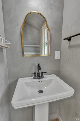 a bathroom with a sink and a mirror