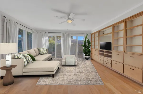 a living room with furniture and a flat screen tv