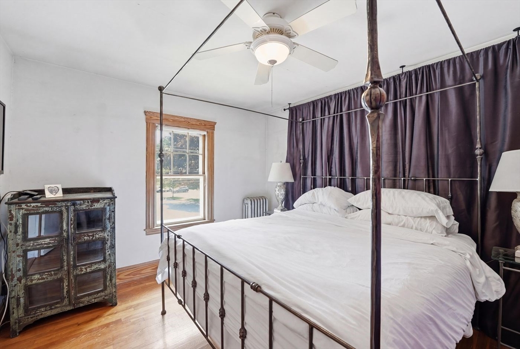 19 Humphrey Street Marblehead, MA 01945 - Photo 19 of 29 a bed sitting in a bedroom next to a window