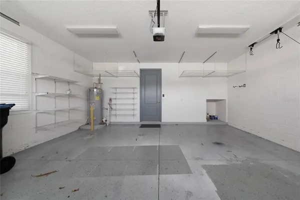 an empty room with shelves and closet