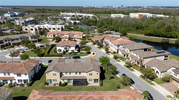 an aerial view of residential houses with outdoor space