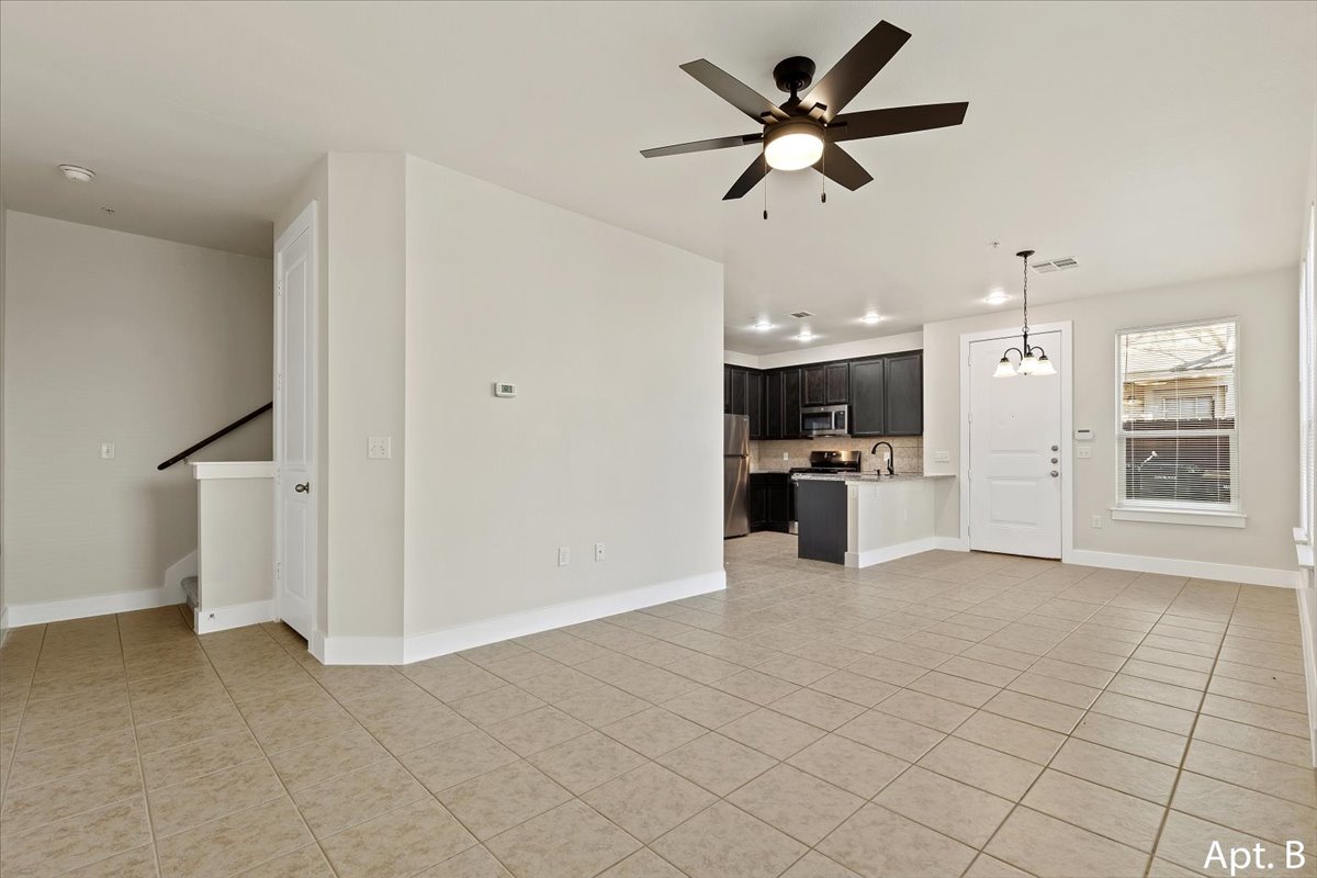 2225 Katy Lane, Unit B Georgetown, TX 78626 - Photo 12 of 22 Unfurnished living room featuring ceiling fan and light tile patterned floors
