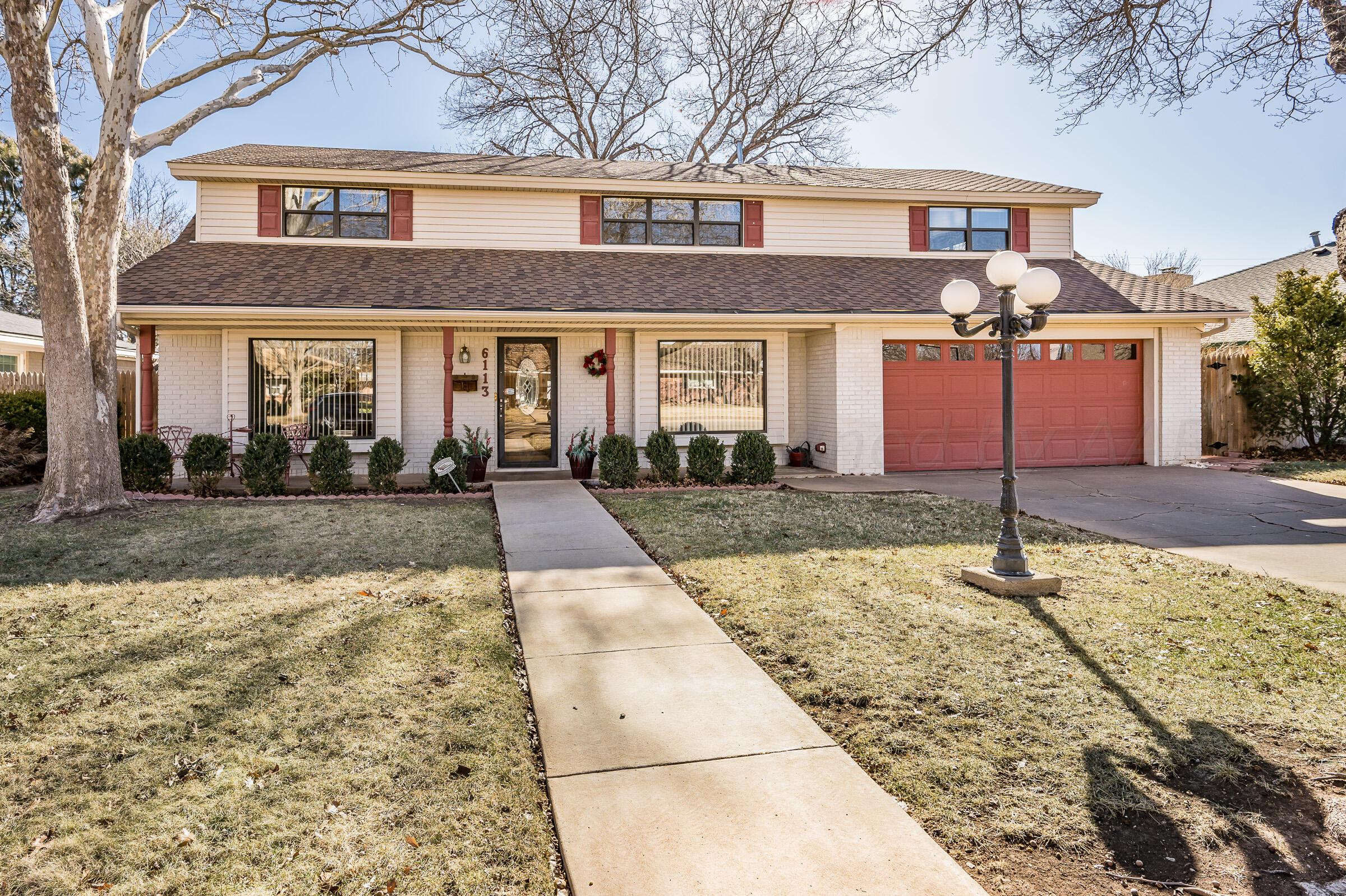 6113 Elmhurst Road Amarillo, TX 79106 - Photo 1 of 28 a front view of house with yard