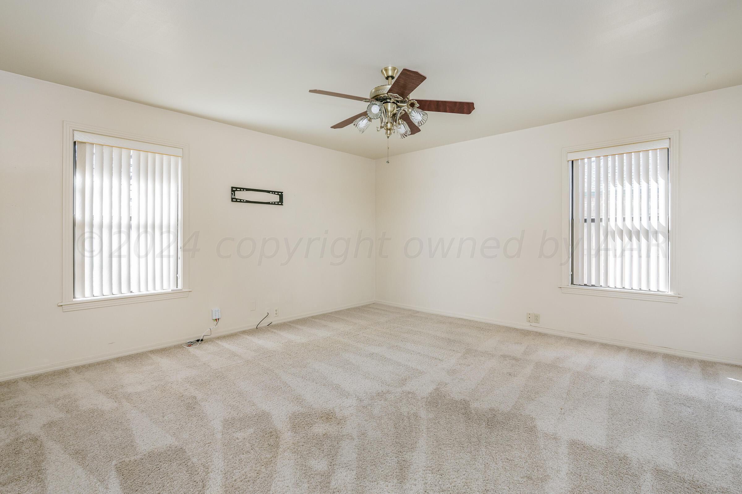 6113 Elmhurst Road Amarillo, TX 79106 - Photo 13 of 28 a view of an empty room with a window