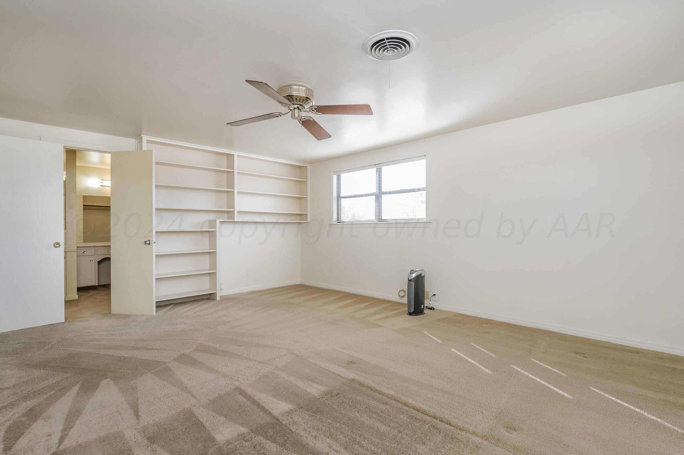 6113 Elmhurst Road Amarillo, TX 79106 - Photo 18 of 28 a view of an empty room with a window