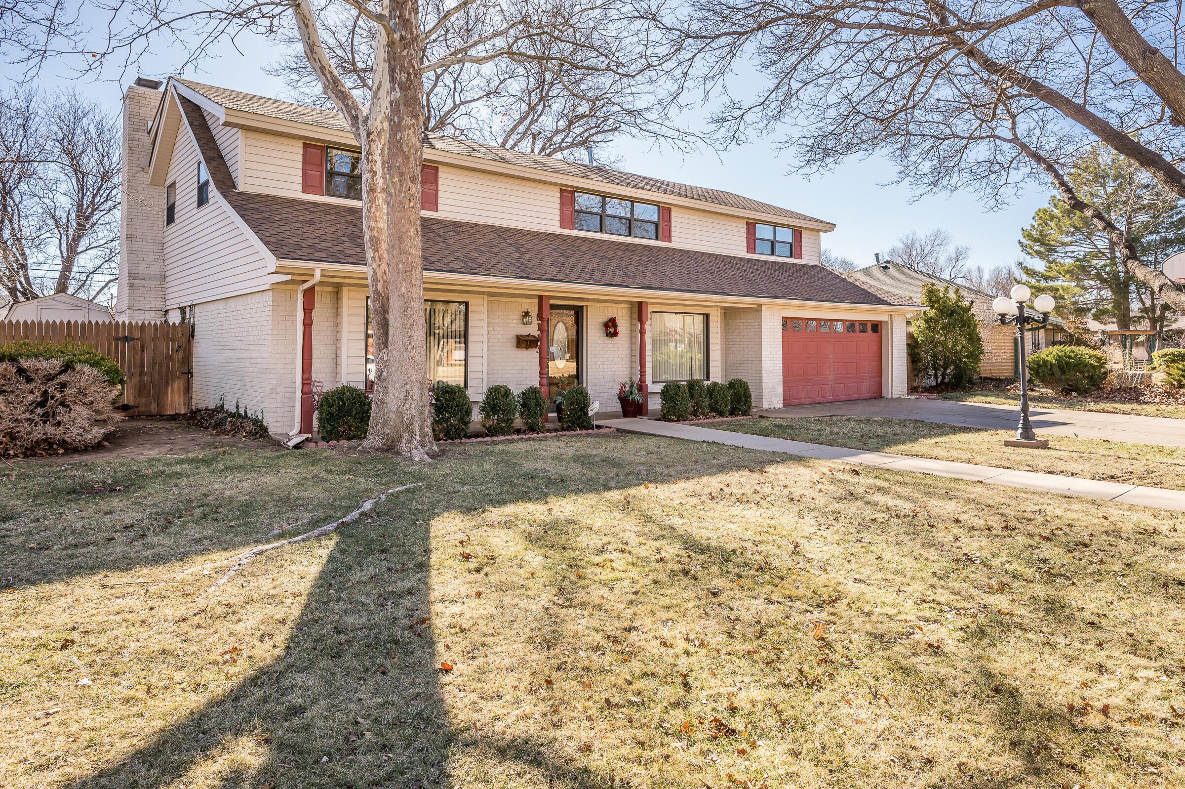 6113 Elmhurst Road Amarillo, TX 79106 - Photo 25 of 28 a front view of a house with a yard